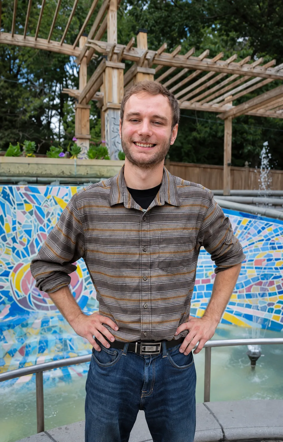 Outdoor portrait beside a mosaic fountain